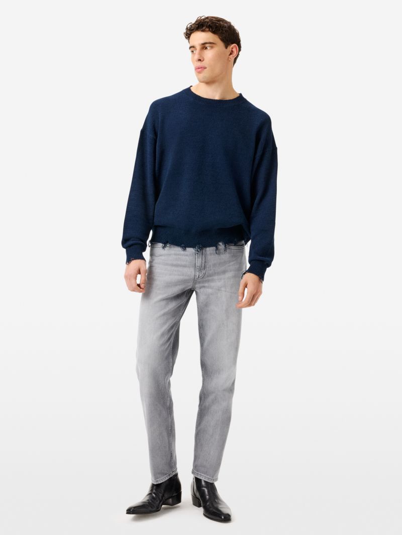 Arty jumper with distressed hem