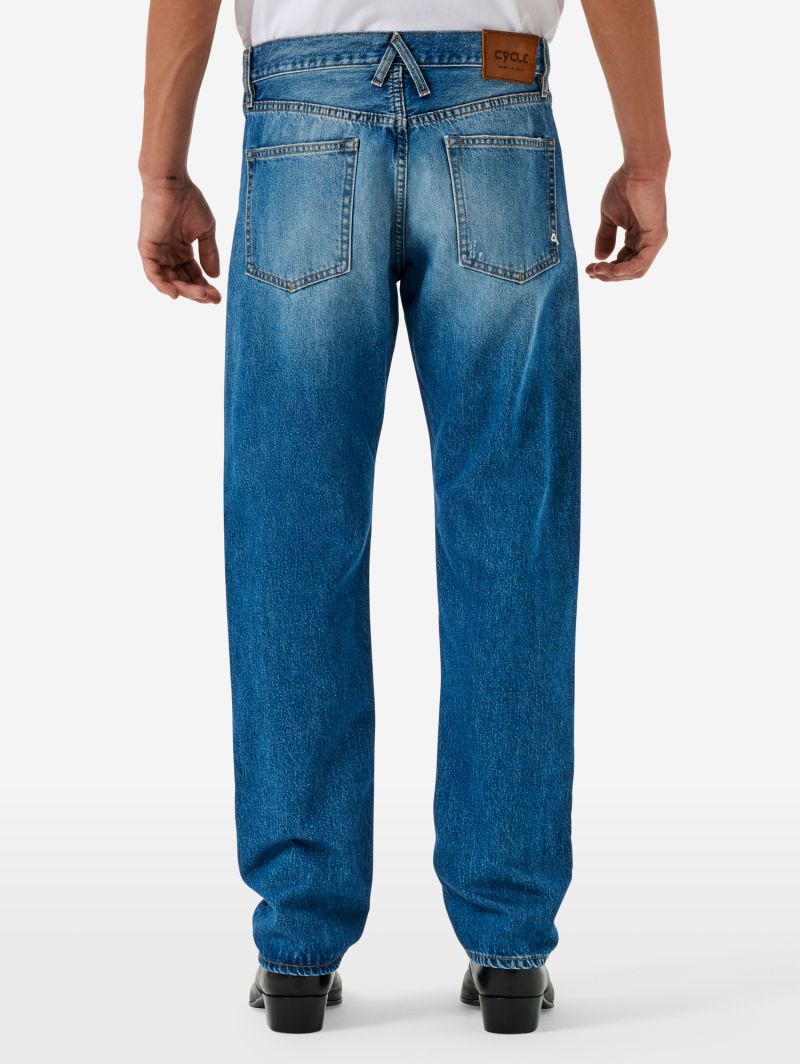 Standard regular straight '90s fit cut and break medium tone open edge